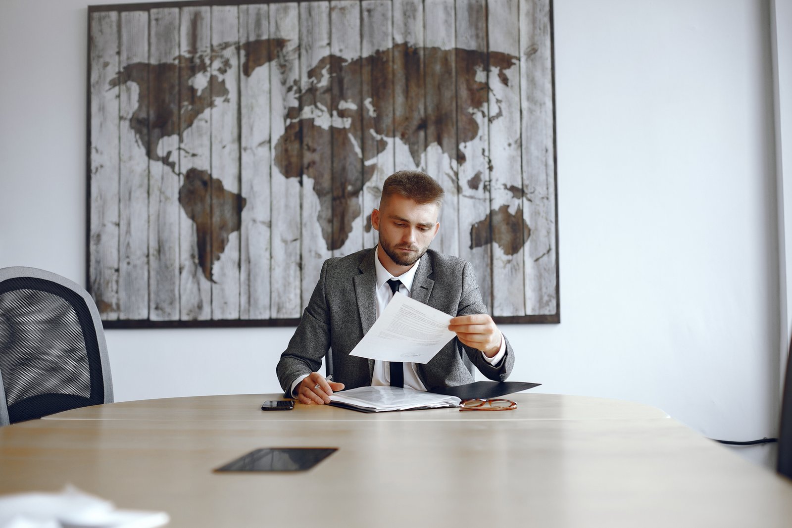 Businessman working in the office.Man reads the contracts. Guy is sitting in the office